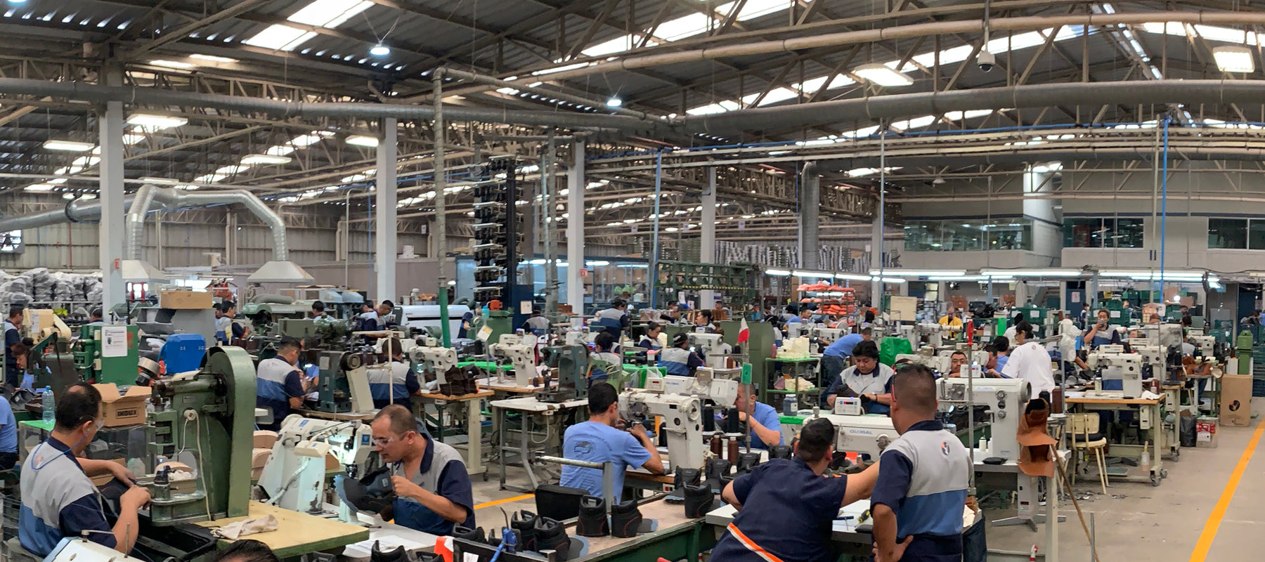 Men and women assembling work boots in Leon, Mexico 